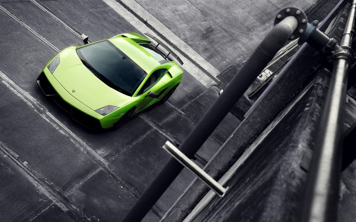 Green Lamborghini on a concrete surface