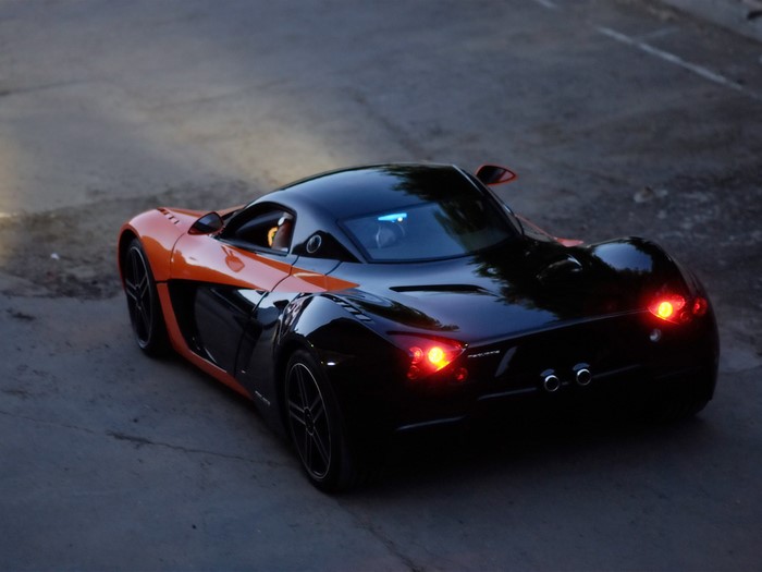 Orange and black Marussia sports car
