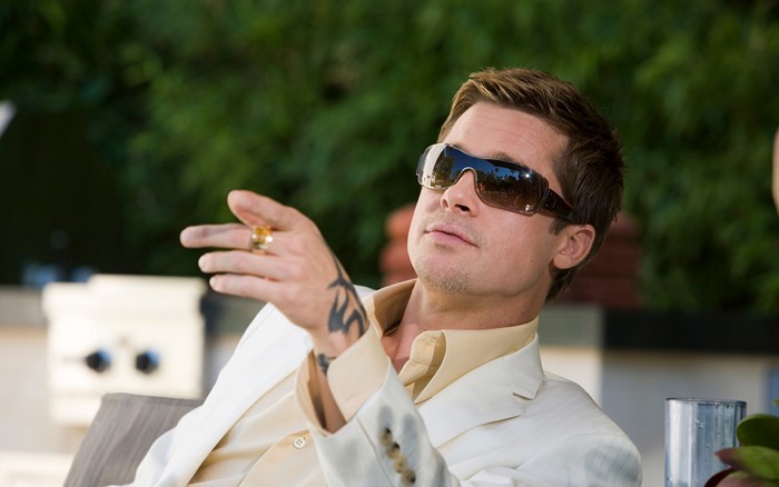 Brad Pitt wearing sunglasses and a suit