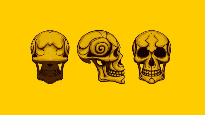 Three golden skulls on a yellow background