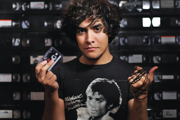 Man holding cassette tape with Michael Jackson Thriller shirt