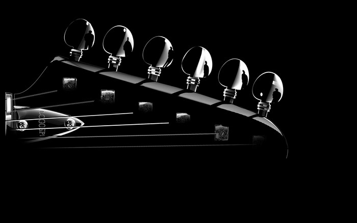 Guitar headstock with tuning pegs and strings
