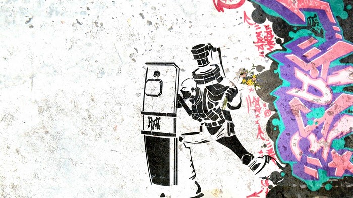 Graffiti art of a riot police officer with a shield