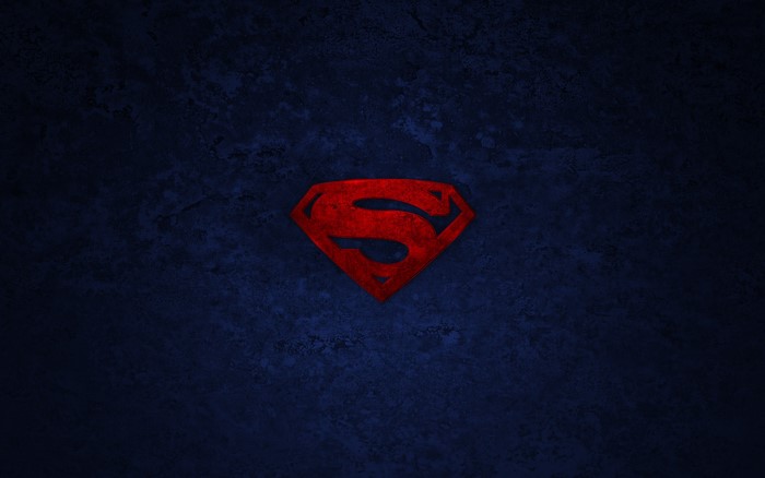 Superman logo on a dark blue background
