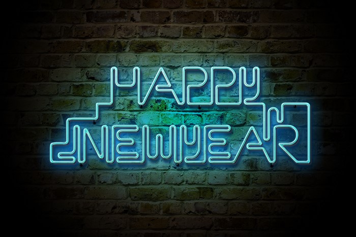 Happy New Year Neon Sign on Brick Wall