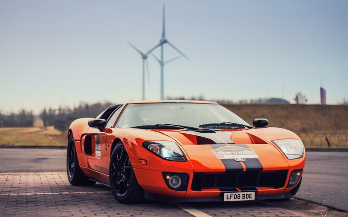 Orange Ford GT with racing stripes