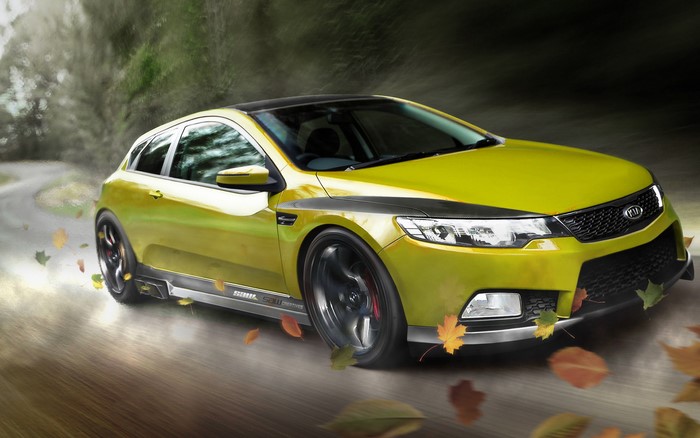 Yellow Kia Forte Koup on a Winding Road