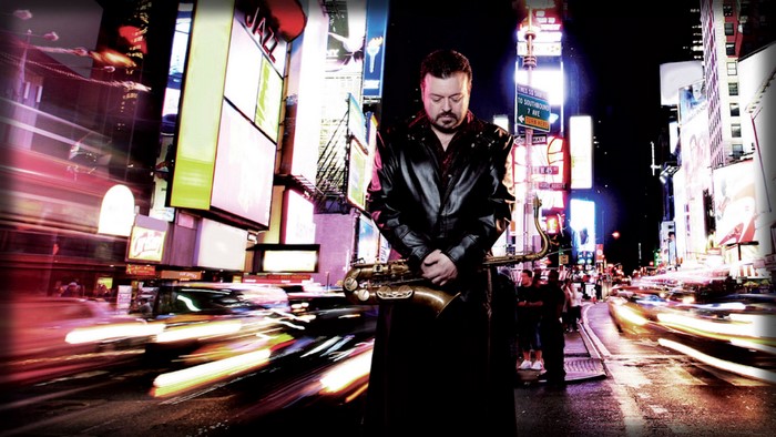Jaared with Saxophone in Times Square at Night