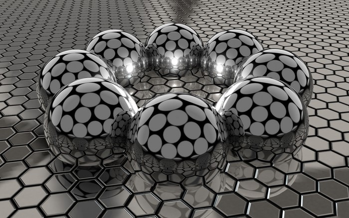 3D spheres with polka dot pattern on hexagonal surface