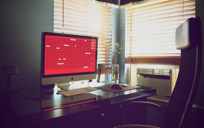 Desk with computer and chair
