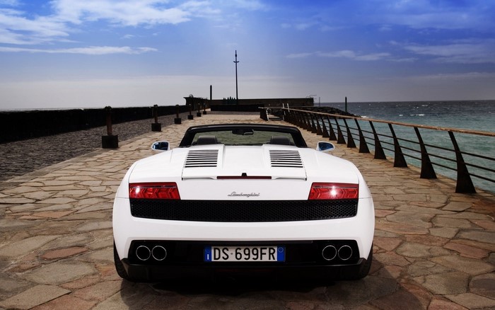 White Lamborghini Gallardo LP 550-4 Spyder on a pier