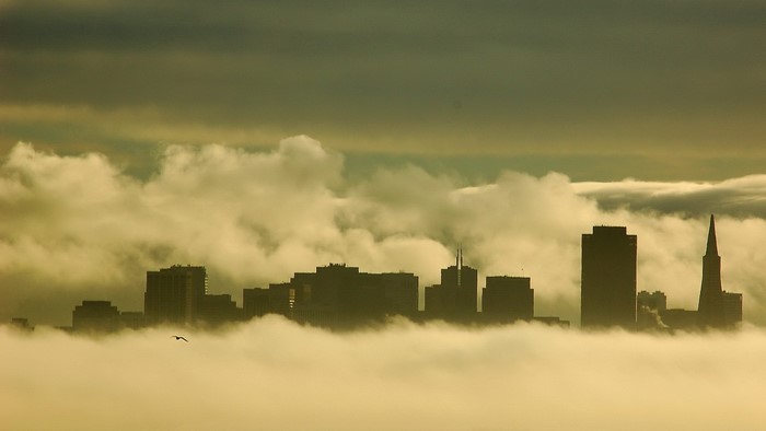 City skyline emerging from fog