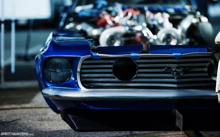 Blue Ford Mustang with exposed engine