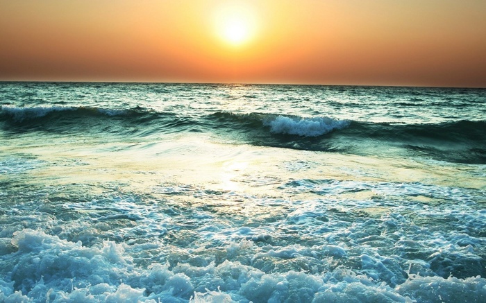 Ocean waves at sunset