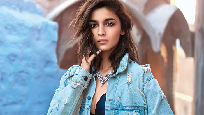 Alia Bhatt in a denim jacket with a necklace
