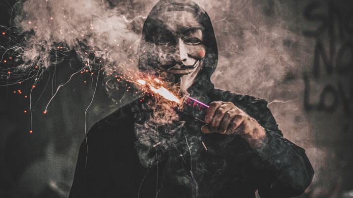 Anonymous mask wearer with sparkler 4K