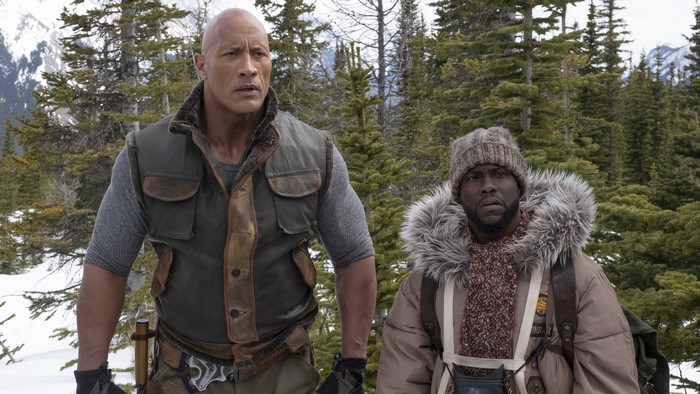 Dwayne Johnson and Kevin Hart in a snowy forest