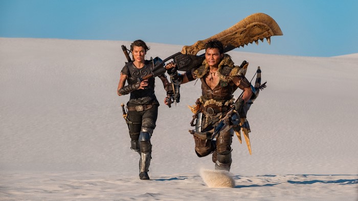 Two warriors running through a desert landscape