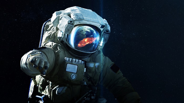 Astronaut in space with Earth reflection