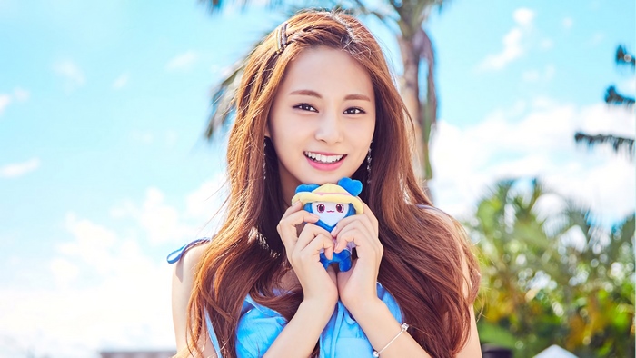Tzuyu from TWICE holding a plush toy