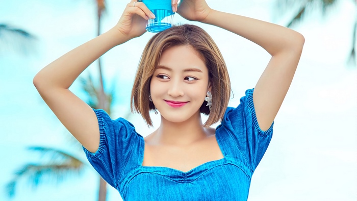 Jihyo from TWICE holding a blue object