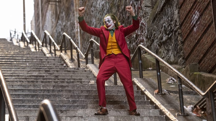 Joker from Batman dancing on stairs