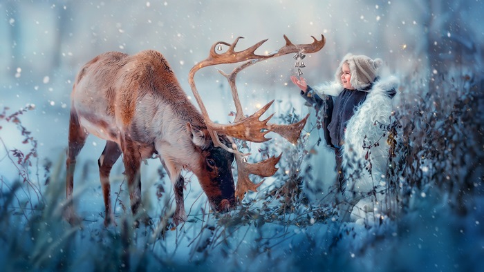 Child with Reindeer in Snow 4K