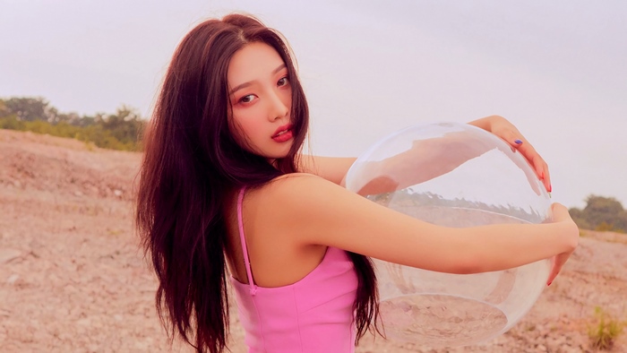 Joy from Red Velvet holding a clear ball