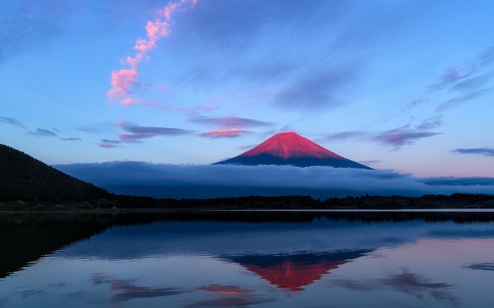 Mount Fuji reflected in a lake at sunrise