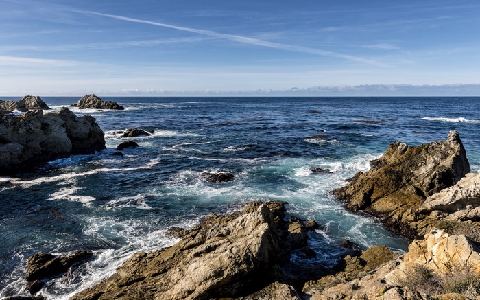 Rocky coastline with waves crashing against rocks