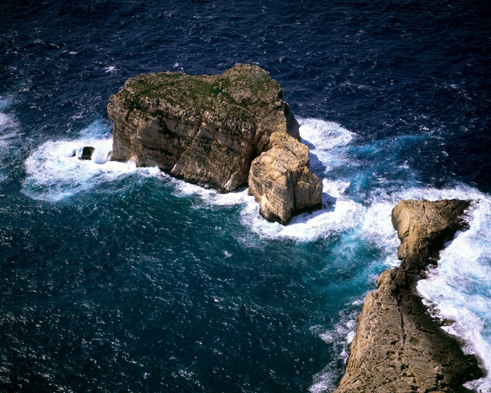 Rocky islands in the ocean with waves