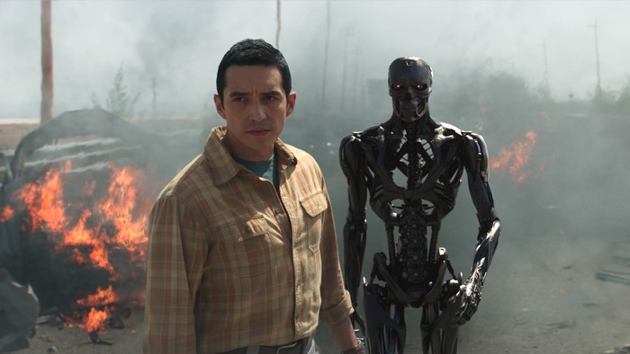 Man and Terminator T-800 in a fiery landscape