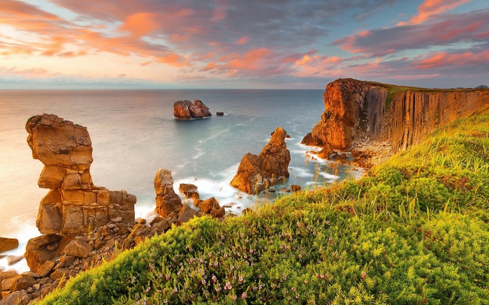 Rocky coastline with sea stacks at sunset