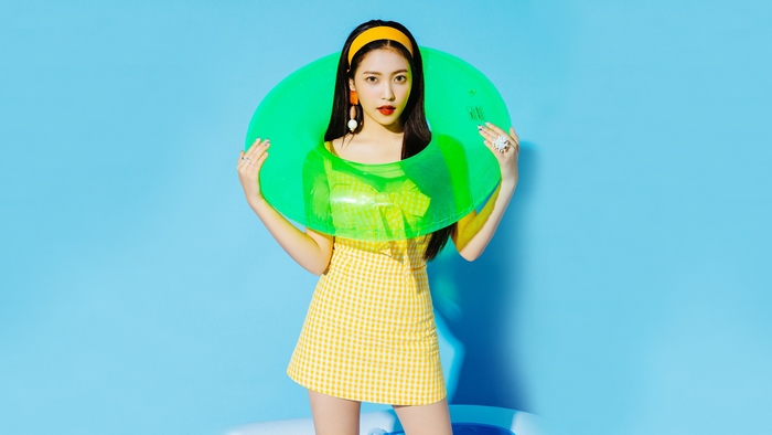 Yeri from Red Velvet with a green inflatable ring