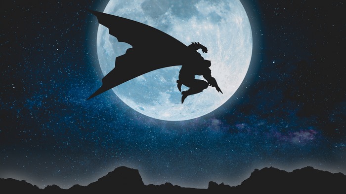 Batman silhouette against a full moon and starry sky