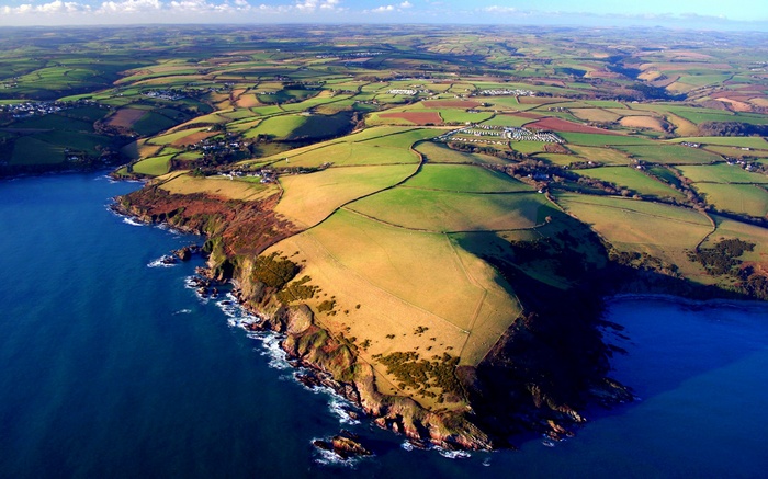 Aerial view of coastal farmland and sea