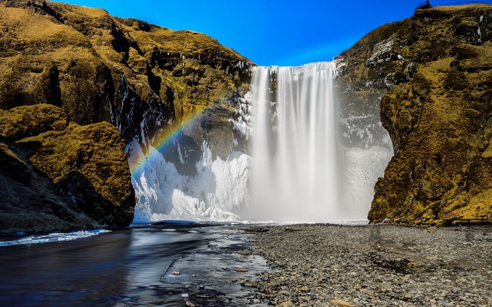 Skogafoss Waterfall with Rainbow in Iceland