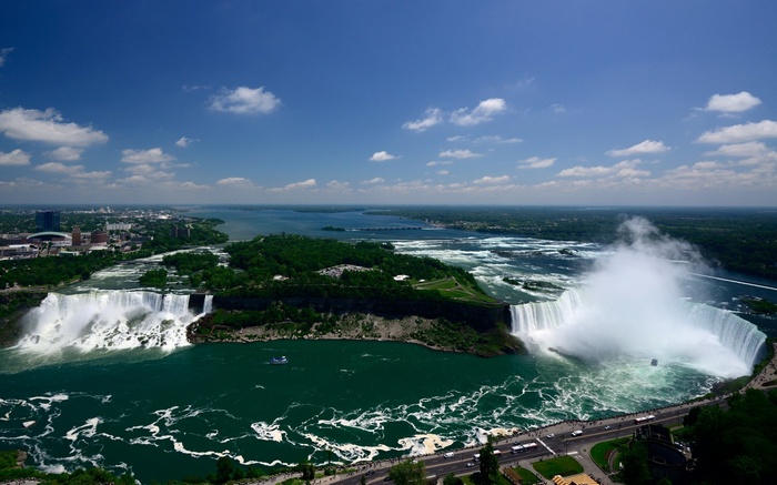 Niagara Falls with a boat and city skyline