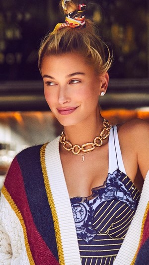 Hailey Baldwin wearing a cardigan and necklace