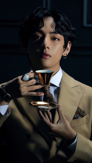 V from BTS holding a teacup