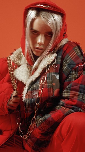 Billie Eilish in red hoodie and plaid jacket