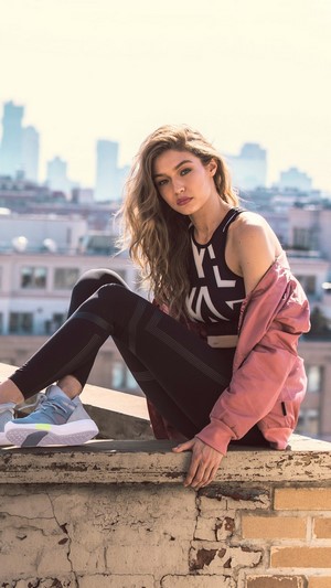 Gigi Hadid on a rooftop with city skyline