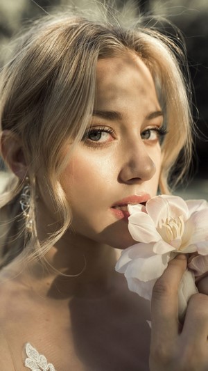 Lili Reinhart close-up portrait with flower