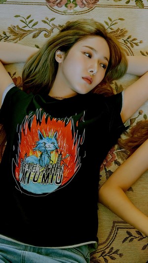 Sowon from GFriend lying on a patterned rug