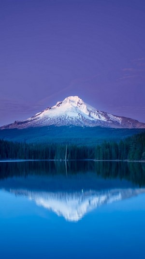 Mountain reflected in a lake at dusk