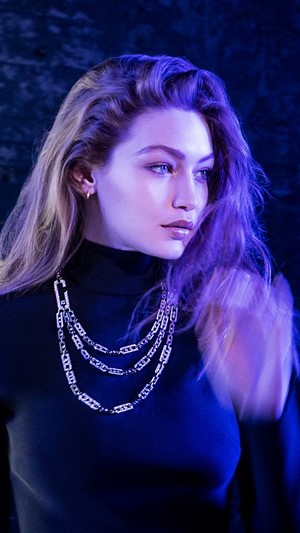 Gigi Hadid wearing a black turtleneck and necklace