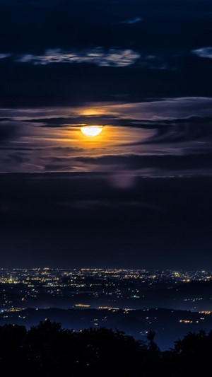 Moonlit Cityscape with Clouds