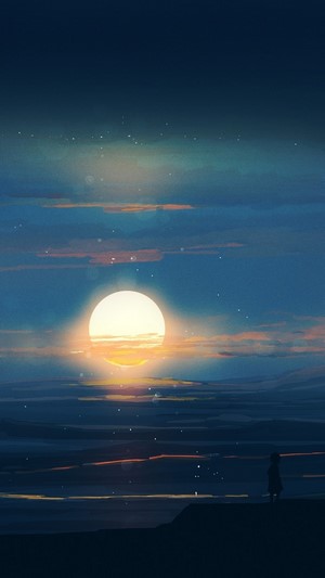 Sunset over the ocean with a lone figure