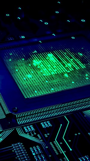 Close-up of a computer chip with binary code