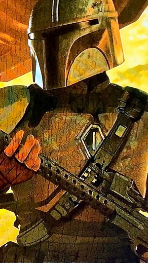 The Mandalorian holding a rifle
